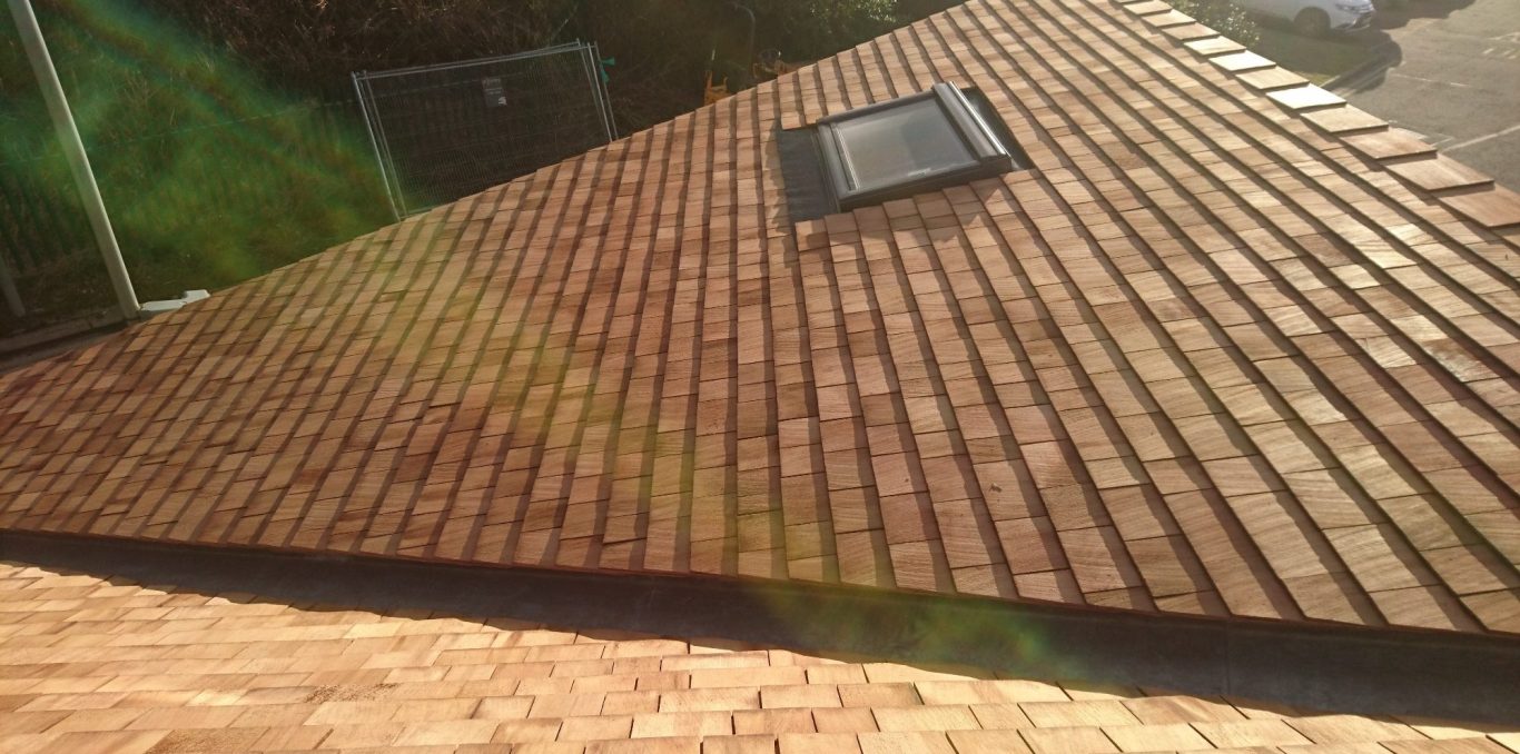 Cedar roof tiles. Cedar roof tiles fitted around velux window